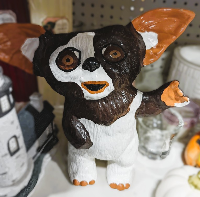 Poorly painted statue of Gizmo from The Gremlins.