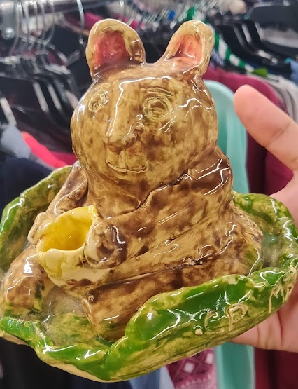 Handmade painted and glazed rabbit with a concerned face.