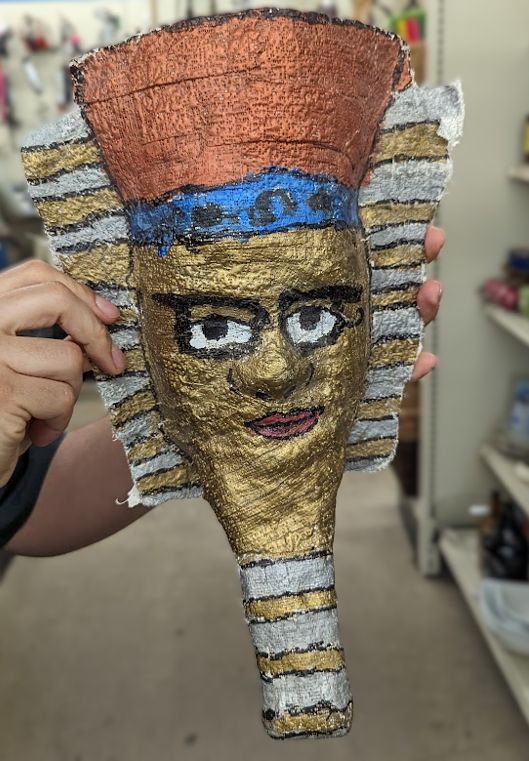 Paper mache Egyptian pharoh head, painted gold.